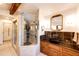 Modern bathroom featuring a luxurious walk-in shower and vanity with stone counter at 11437 Tomichi Dr, Franktown, CO 80116