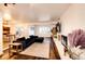 Inviting living room with fireplace, ample natural light, and hardwood flooring at 11437 Tomichi Dr, Franktown, CO 80116