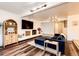 Stylish living room with a modern fireplace, a flat-screen TV, and comfortable seating at 11437 Tomichi Dr, Franktown, CO 80116