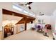 Bright loft space with vaulted ceilings, skylights, and a fun play area at 11437 Tomichi Dr, Franktown, CO 80116