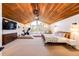 Large main bedroom with a wood ceiling, a private balcony, and an exercise area at 11437 Tomichi Dr, Franktown, CO 80116