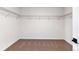 Walk-in closet with installed shelving and carpeted floor at 25284 E Warren Pl, Aurora, CO 80018