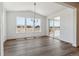 Spacious living room with large windows and hardwood floors, perfect for entertaining at 25284 E Warren Pl, Aurora, CO 80018