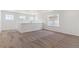 Upstairs loft area with multiple windows for natural light at 25284 E Warren Pl, Aurora, CO 80018