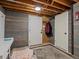 Finished basement area featuring wood paneled walls and two access doors at 280 E 11Th Ave, Broomfield, CO 80020