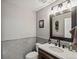 Stylish bathroom with a modern vanity, framed mirror, neutral tile backsplash, and sleek fixtures at 280 E 11Th Ave, Broomfield, CO 80020