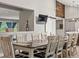 Elegant dining room featuring a large table, stylish chairs, and a sliding barn door for a modern touch at 280 E 11Th Ave, Broomfield, CO 80020