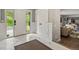 Bright entryway with wainscoting, tile floors, and an open floorplan showcasing an adjacent sitting room at 280 E 11Th Ave, Broomfield, CO 80020