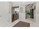 Bright entryway with wainscoting, tile floors, and an open staircase showcasing an open layout and natural light at 280 E 11Th Ave, Broomfield, CO 80020