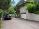 Home exterior with a long driveway, attached garage, and well-maintained yard surrounded by trees at 280 E 11Th Ave, Broomfield, CO 80020