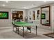 Spacious game room featuring a ping pong table and a decorative accent wall at 280 E 11Th Ave, Broomfield, CO 80020