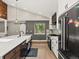 Well-appointed kitchen features a large island with a farmhouse sink, custom cabinets, and stainless steel appliances at 280 E 11Th Ave, Broomfield, CO 80020
