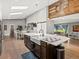 Open kitchen showcasing a large island with a farmhouse sink, stainless steel appliances, and seamless access to other spaces at 280 E 11Th Ave, Broomfield, CO 80020