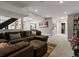Open-concept living room featuring a large sectional sofa and recessed lighting at 280 E 11Th Ave, Broomfield, CO 80020