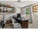 Functional home office featuring a sleek desk, shelving, and a large window providing natural light at 280 E 11Th Ave, Broomfield, CO 80020