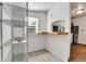 Pantry area with tiled floor, wire shelving, and a pass-through window to the kitchen area at 6670 Hooker St, Denver, CO 80221