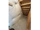 The attic reveals insulation and wooden structural elements, providing space for storage at 9011 Sandpiper Dr, Longmont, CO 80504