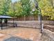 Spacious backyard with a gazebo, basketball hoop, and decorative retaining wall for outdoor recreation at 9011 Sandpiper Dr, Longmont, CO 80504
