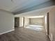 Spacious basement featuring hardwood floors, carpet flooring, and an open layout at 9011 Sandpiper Dr, Longmont, CO 80504