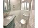 Charming bathroom featuring a modern vanity, decorative tile, and a shower at 9011 Sandpiper Dr, Longmont, CO 80504