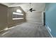 Bedroom with vaulted ceiling, a ceiling fan and large window at 9011 Sandpiper Dr, Longmont, CO 80504