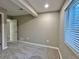 The bright bedroom features neutral walls, plush carpet, and a window at 9011 Sandpiper Dr, Longmont, CO 80504
