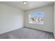 Clean bedroom offers great natural light and neutral carpet at 8445 Eldora Way, Arvada, CO 80007