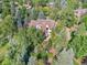 Tree-lined property with a large house in the center at 6325 E Tufts Ave, Cherry Hills Village, CO 80111