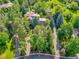 Aerial view of house, expansive lot, and mature trees at 6325 E Tufts Ave, Cherry Hills Village, CO 80111