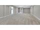 Finished basement with open layout and carpet flooring at 6325 E Tufts Ave, Cherry Hills Village, CO 80111