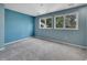 Spacious bedroom with light blue walls and carpet at 6325 E Tufts Ave, Cherry Hills Village, CO 80111