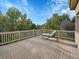 Spacious deck with wooded views and chaise lounge at 6325 E Tufts Ave, Cherry Hills Village, CO 80111