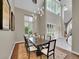 Elegant dining room with a large table and high ceilings at 6325 E Tufts Ave, Cherry Hills Village, CO 80111