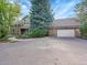 Two-car garage and stone facade at 6325 E Tufts Ave, Cherry Hills Village, CO 80111