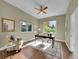 Bright home office with hardwood floors and built-in shelving at 6325 E Tufts Ave, Cherry Hills Village, CO 80111