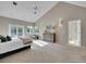 Main bedroom with high ceilings, carpet, and ensuite bath at 6325 E Tufts Ave, Cherry Hills Village, CO 80111