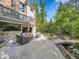 Ground level patio with seating area and bridge feature at 6325 E Tufts Ave, Cherry Hills Village, CO 80111