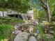 Serene water feature with a pond and natural landscaping, creating a peaceful ambiance at 6325 E Tufts Ave, Cherry Hills Village, CO 80111