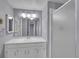 Bathroom featuring a white vanity, a large mirror, and a stand up shower at 4064 S Atchison Way # 204, Aurora, CO 80014