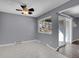 Dining room with ceiling fan, tile flooring, and sliding glass doors to balcony at 4064 S Atchison Way # 204, Aurora, CO 80014