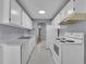 Efficient kitchen featuring white cabinets, and a standard oven and range at 4064 S Atchison Way # 204, Aurora, CO 80014