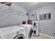 Laundry area features a modern washer and dryer set and includes the hot water heater at 4064 S Atchison Way # 204, Aurora, CO 80014