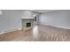 Bright living room featuring a stone fireplace and wood-look flooring at 4064 S Atchison Way # 204, Aurora, CO 80014