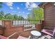Balcony view overlooking rooftops and green trees on a clear sky day at 8010 Holland Ct # D, Arvada, CO 80005