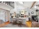 Open-concept kitchen with granite countertops, stainless steel appliances, and breakfast bar at 8010 Holland Ct # D, Arvada, CO 80005