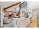 Kitchen showcasing a breakfast bar, granite countertops, and open layout to living area at 8010 Holland Ct # D, Arvada, CO 80005