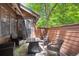 An outdoor patio features a table, 4 chairs, and shade on a sunny day at 8010 Holland Ct # D, Arvada, CO 80005