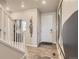 Bright entryway with hardwood floors and modern light fixture at 1465 Bloom St, Brighton, CO 80601