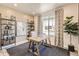 Bright home office features built-in shelving and window views at 1465 Bloom St, Brighton, CO 80601