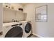 Convenient laundry room with Whirlpool washer and dryer at 1465 Bloom St, Brighton, CO 80601